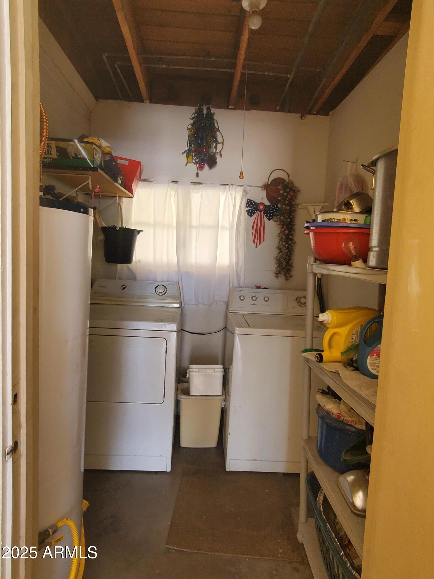 3041 East Osborn Road Phoenix, AZ 85016 - Photo 7 of 22 a kitchen with a refrigerator and cabinets