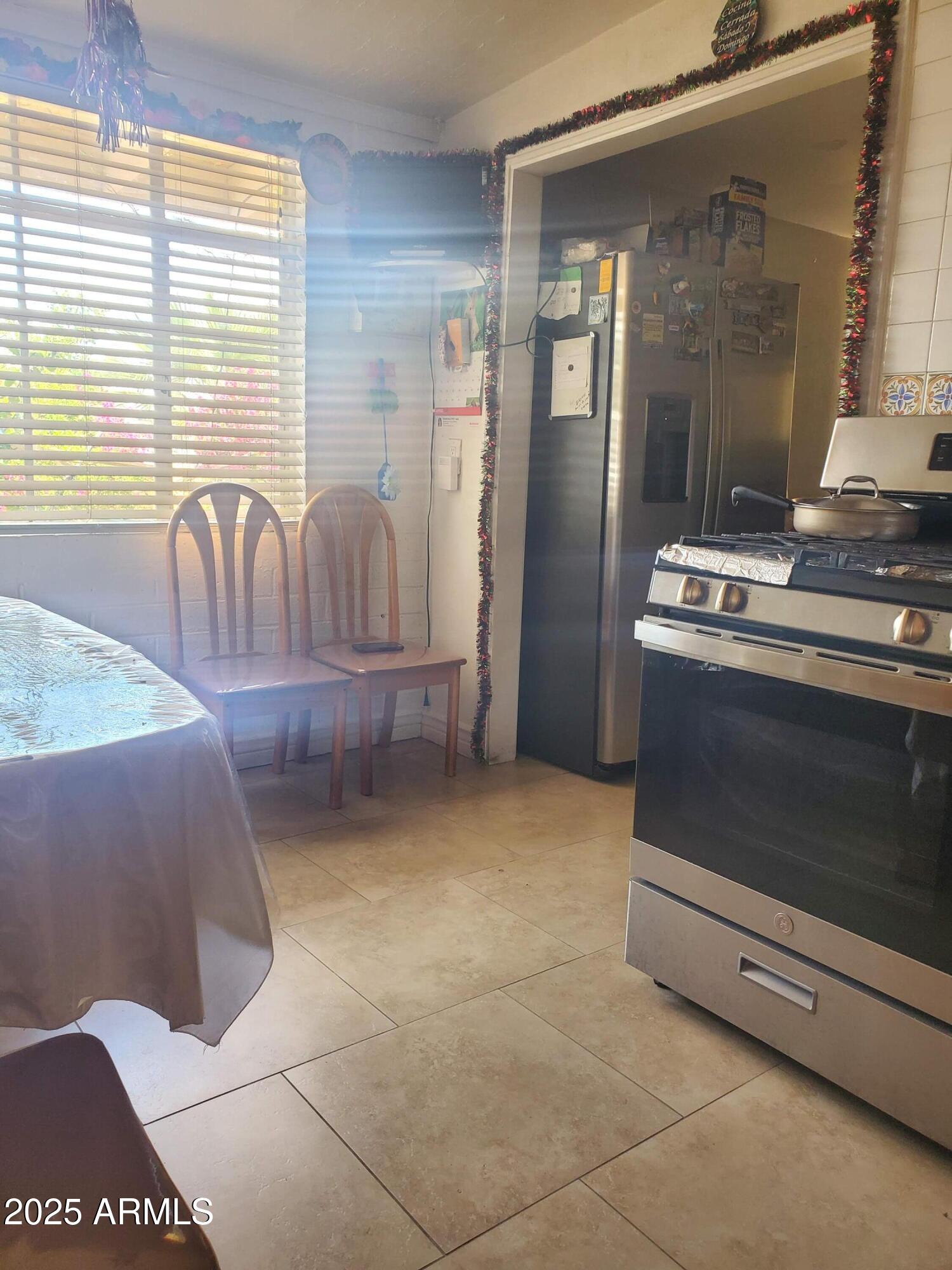 3041 East Osborn Road Phoenix, AZ 85016 - Photo 9 of 22 a kitchen with granite countertop a stove and a microwave