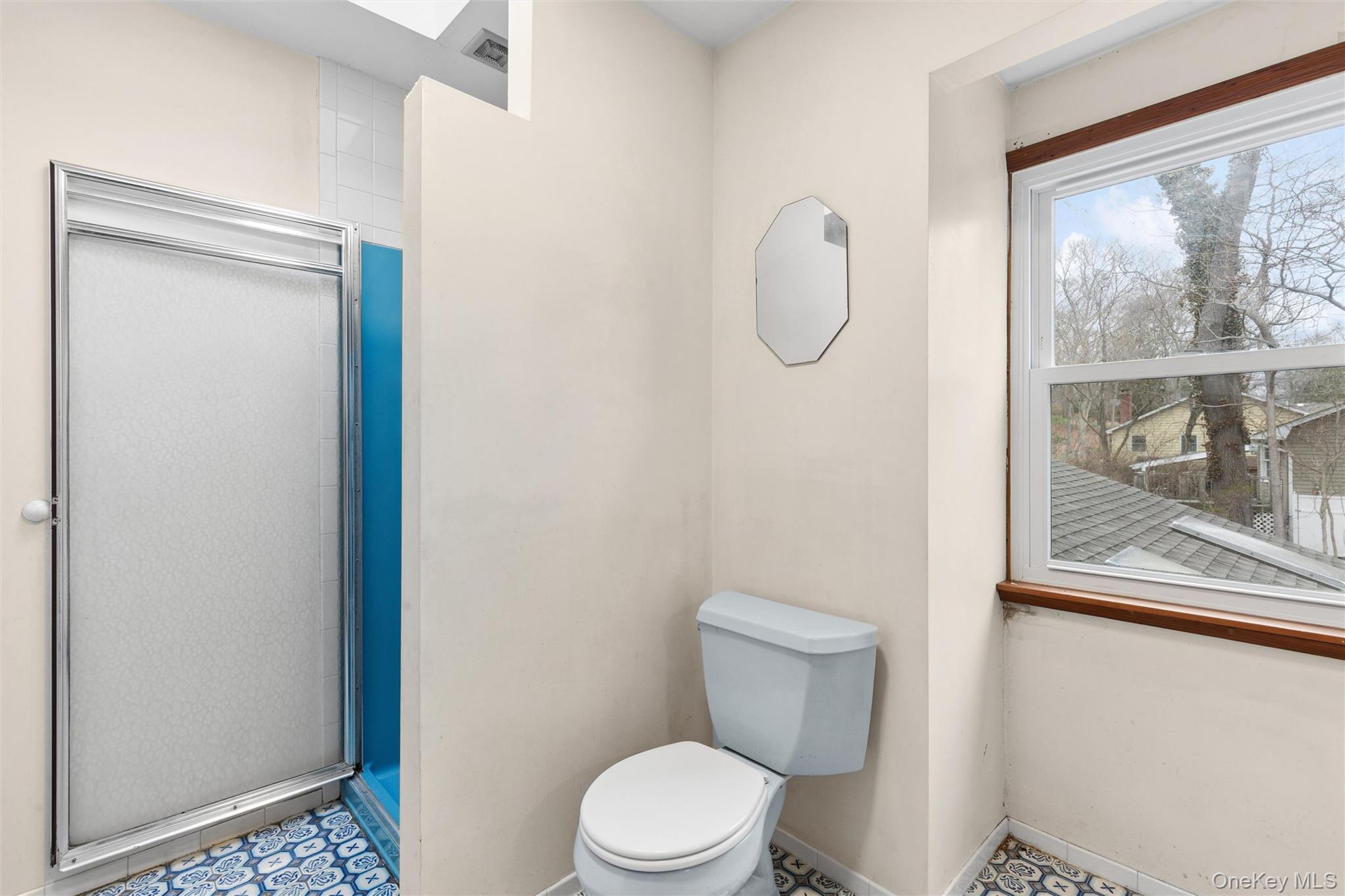 49 Overhill Road Wading River, NY 11792 - Photo 21 of 27 a white toilet sitting next to a bathroom sink