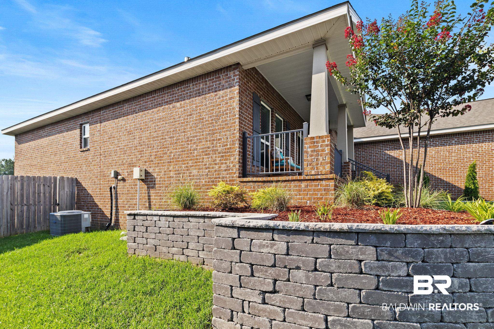 31541 Hoot Owl Road Daphne, AL 36527 - Photo 46 of 51 View of home's exterior featuring central AC and a lawn
