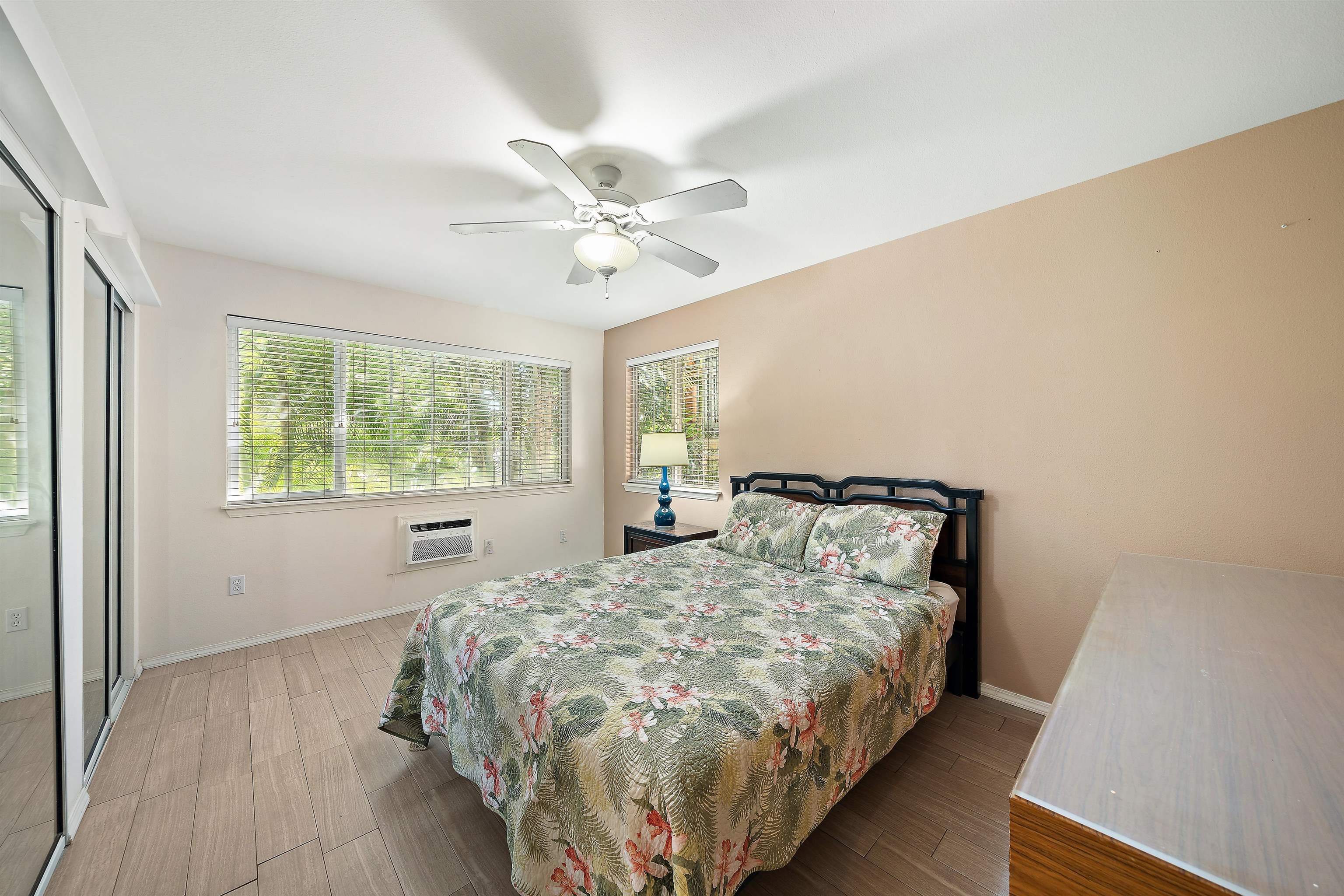 65 Halili Lane, Unit 10F Kihei, HI 96753 - Photo 29 of 48 a bedroom with a bed and a window