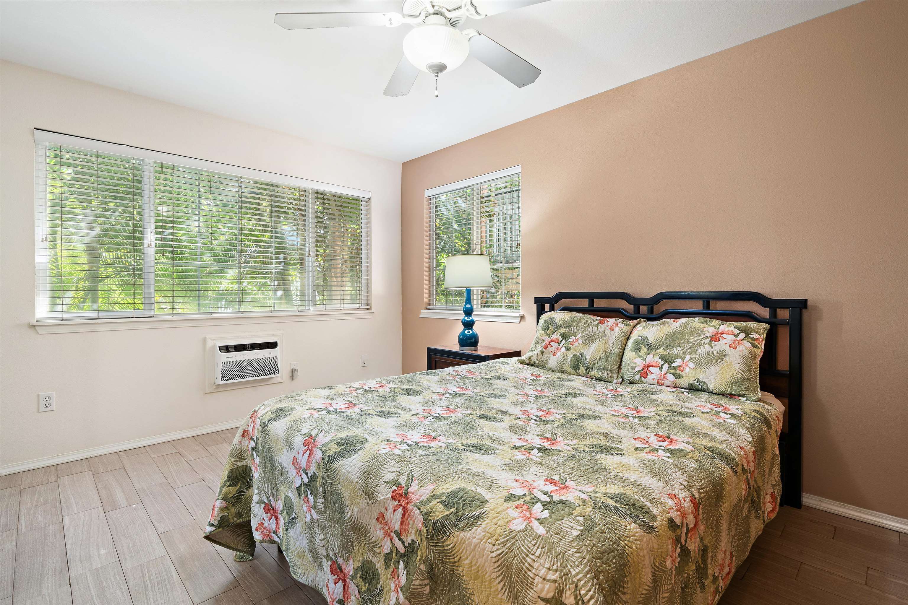65 Halili Lane, Unit 10F Kihei, HI 96753 - Photo 32 of 48 a bedroom with a large bed and a window