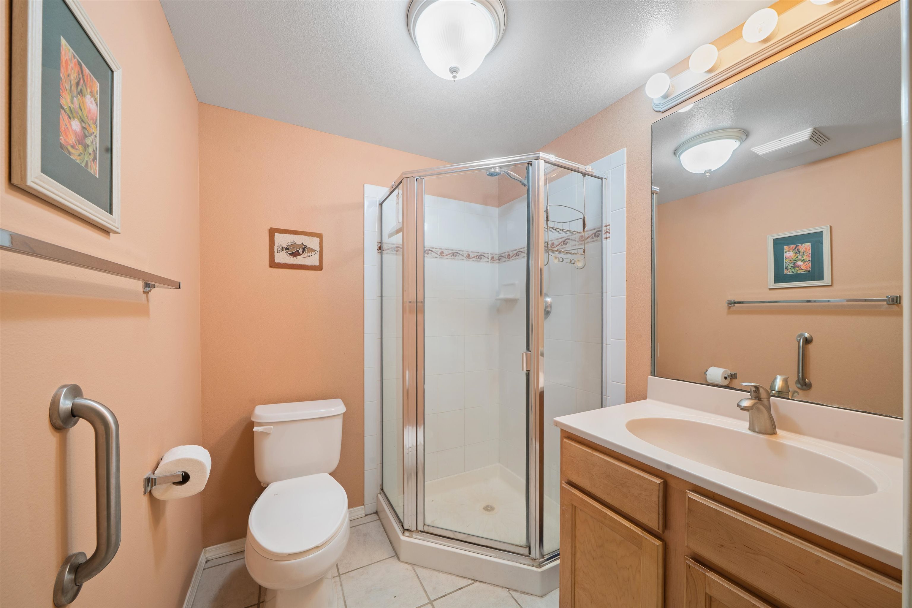 65 Halili Lane, Unit 10F Kihei, HI 96753 - Photo 35 of 48 a bathroom with a sink toilet and shower