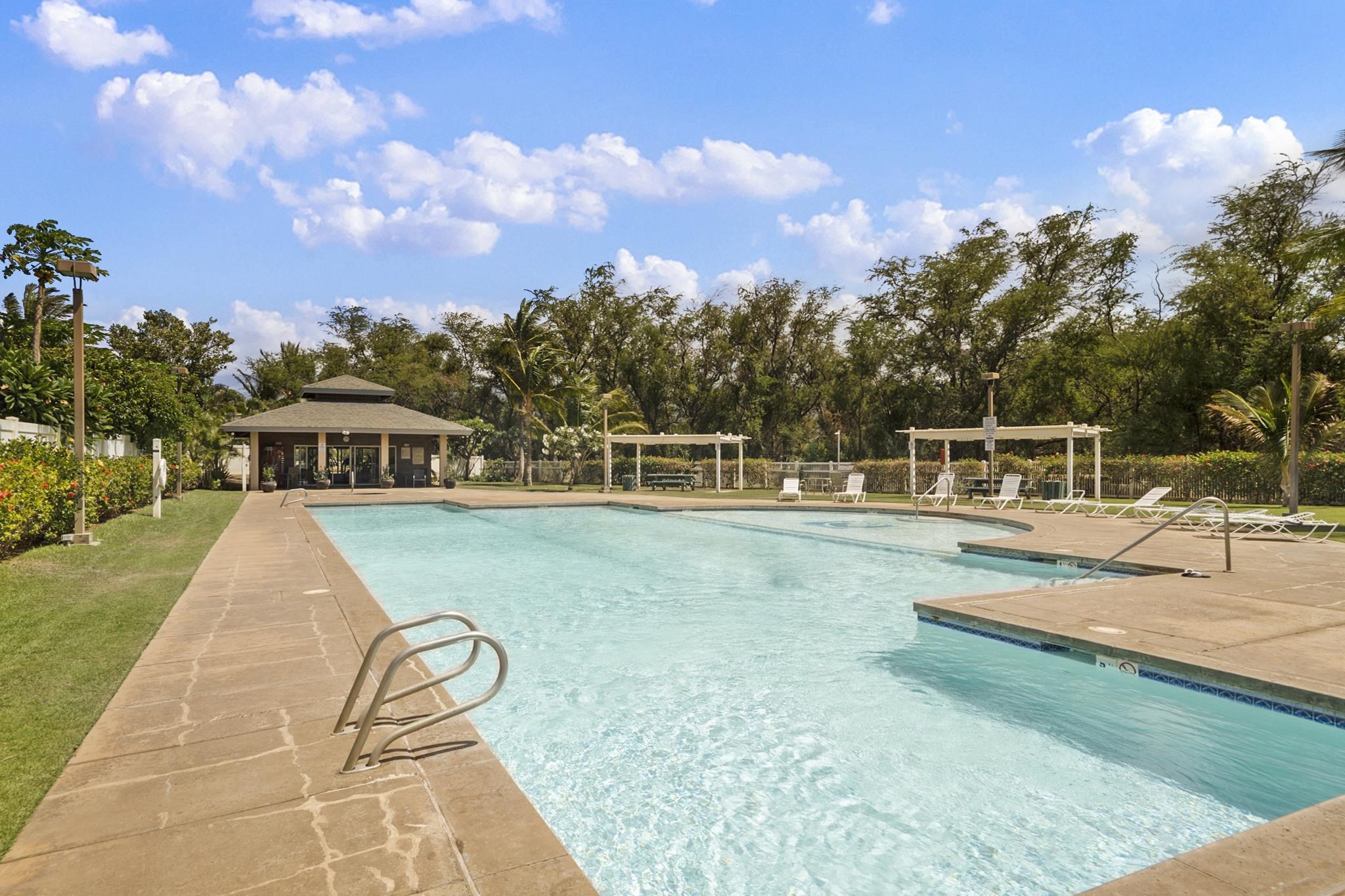 65 Halili Lane, Unit 10F Kihei, HI 96753 - Photo 39 of 48 a view of a swimming pool with a lounge chair