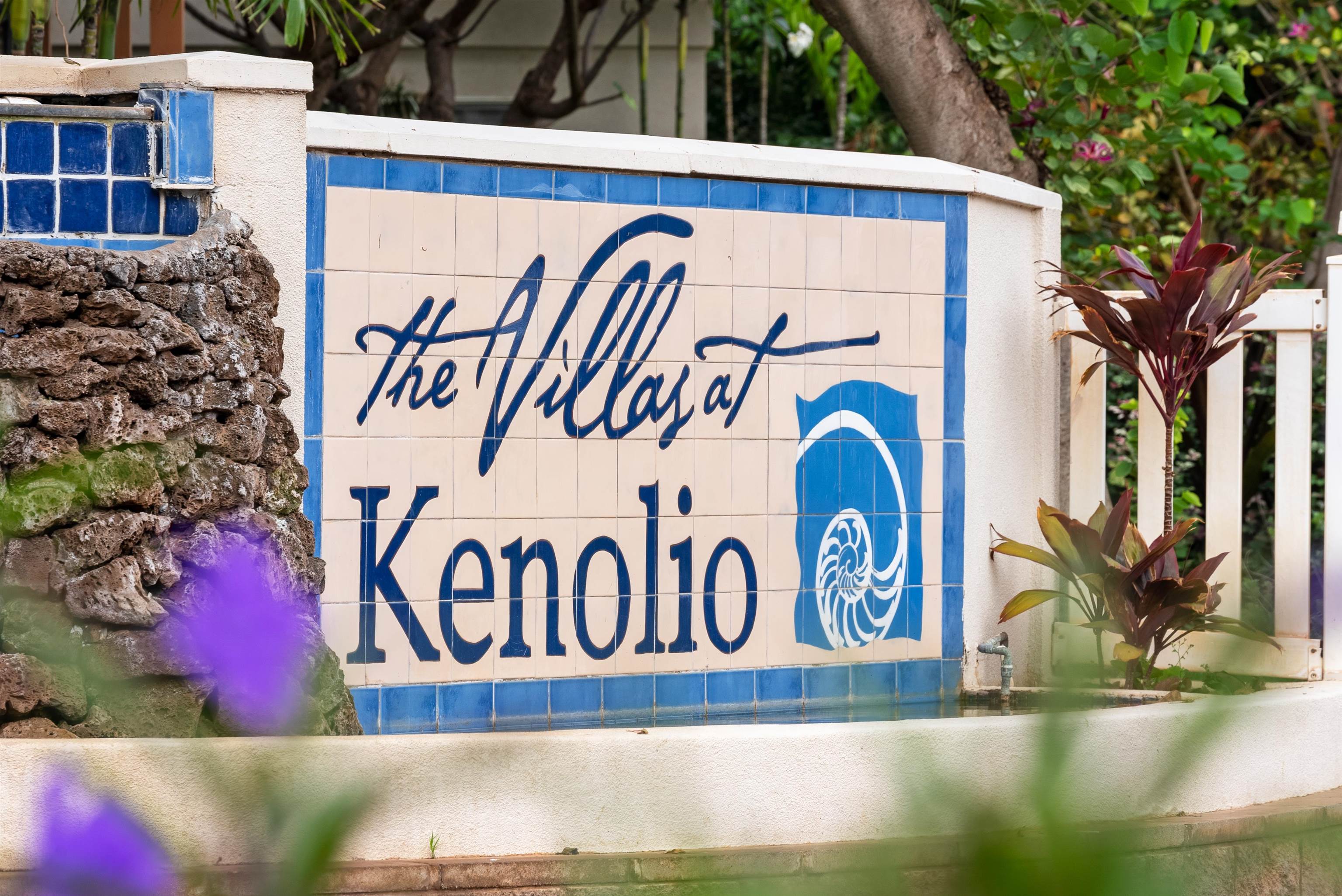 65 Halili Lane, Unit 10F Kihei, HI 96753 - Photo 48 of 48 a street sign on a wall next to a building