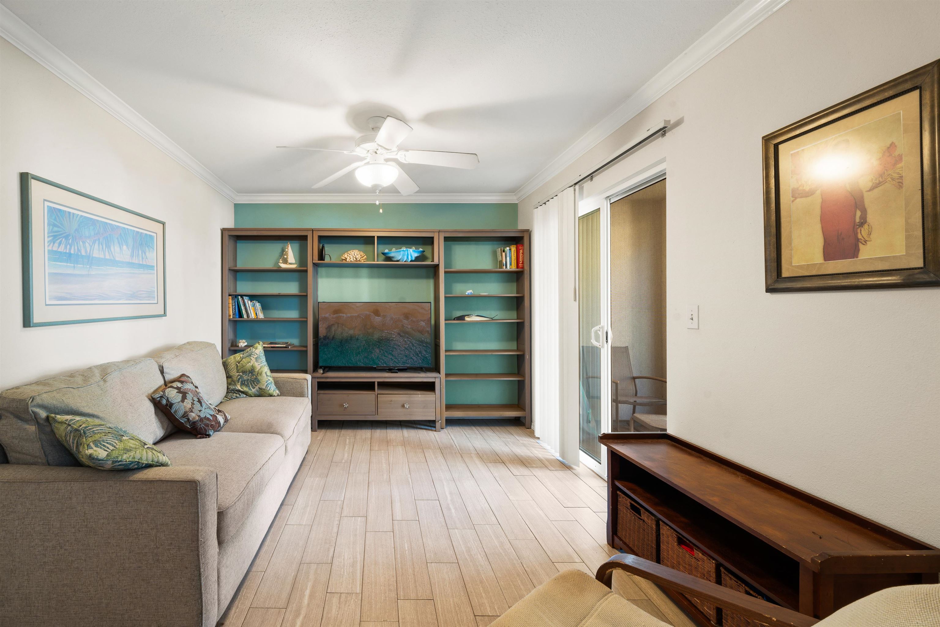 65 Halili Lane, Unit 10F Kihei, HI 96753 - Photo 5 of 48 a living room with furniture and a flat screen tv