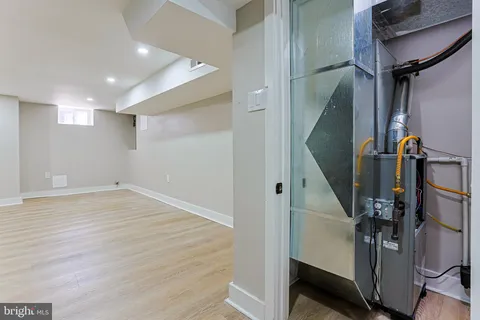 a view of a room with wooden floor