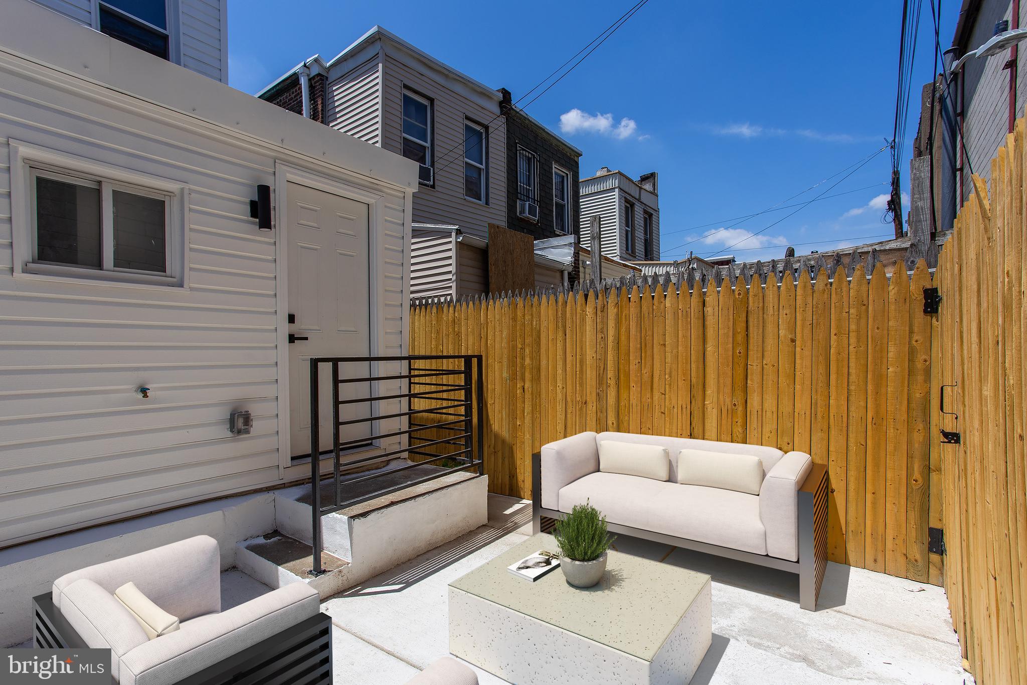 2129 East Tioga Street Philadelphia, PA 19134 - Photo 4 of 32 a view of a patio with couches and potted plants