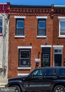 a outdoor view of a building with car parked