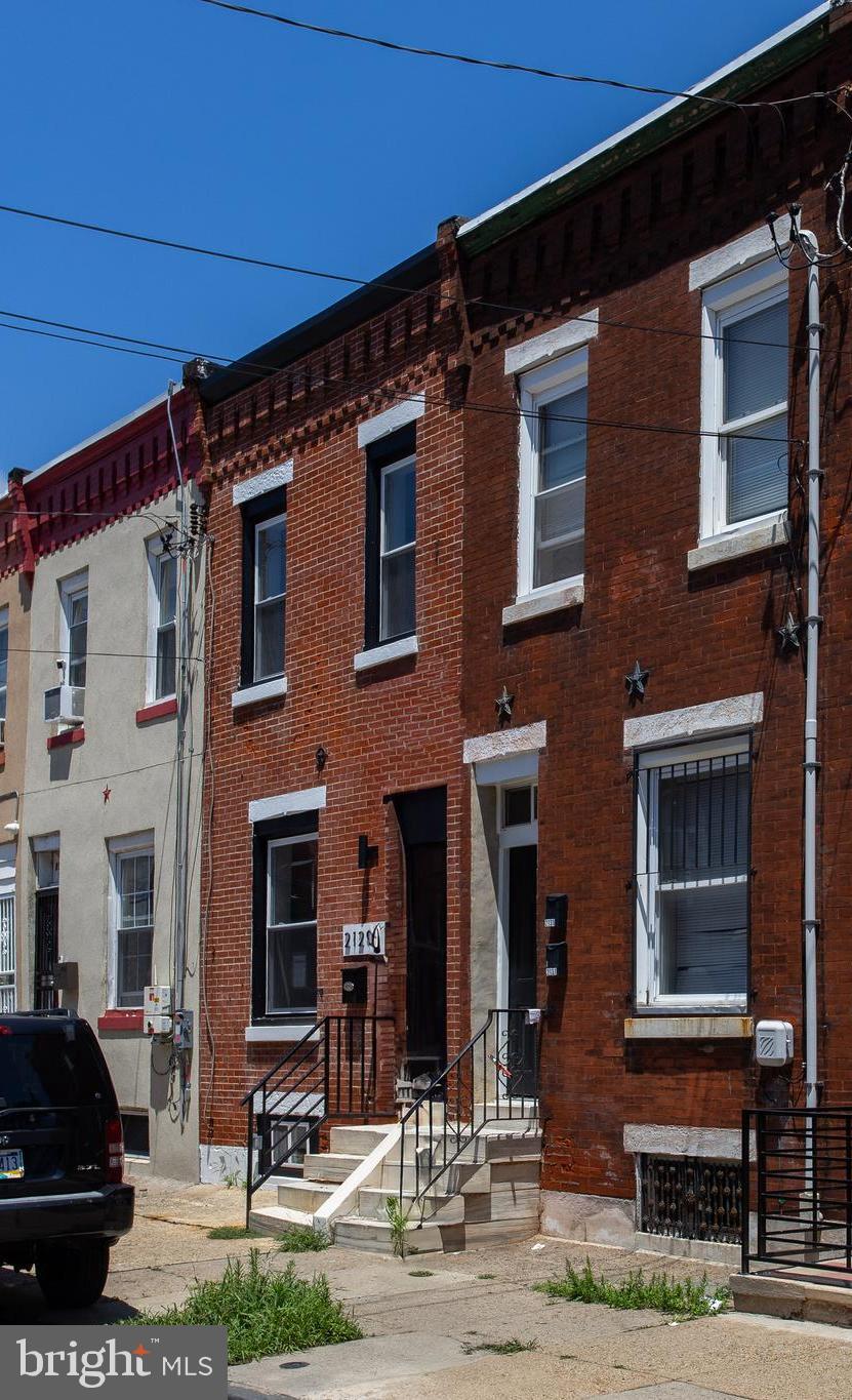 2129 East Tioga Street Philadelphia, PA 19134 - Photo 6 of 32 a front view of a building with street view