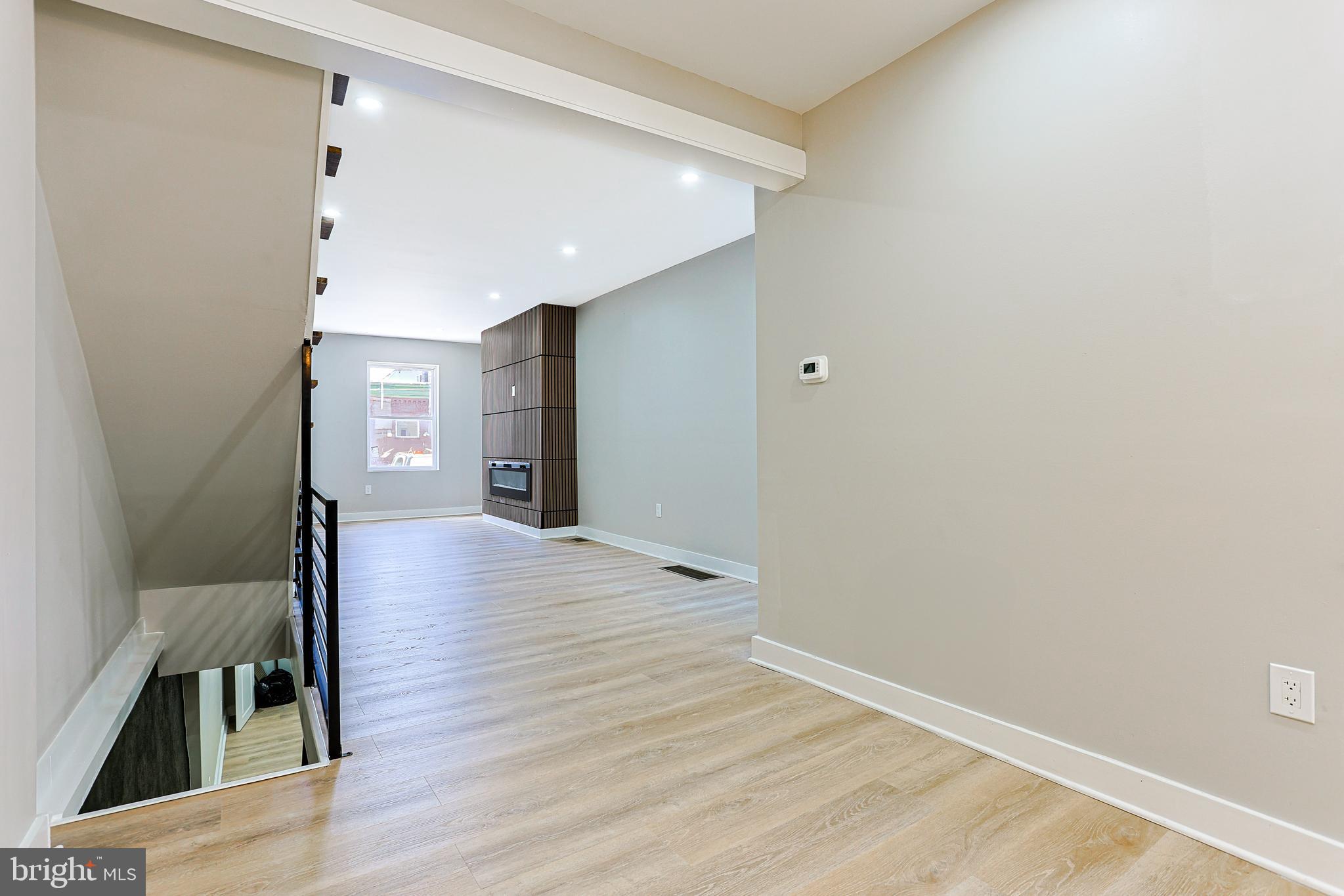 2129 East Tioga Street Philadelphia, PA 19134 - Photo 10 of 32 a view of a hallway with wooden floor