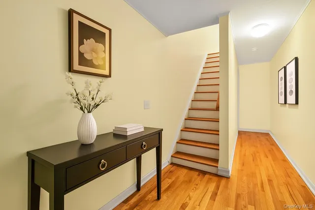 a view of a workspace with furniture and wooden floor