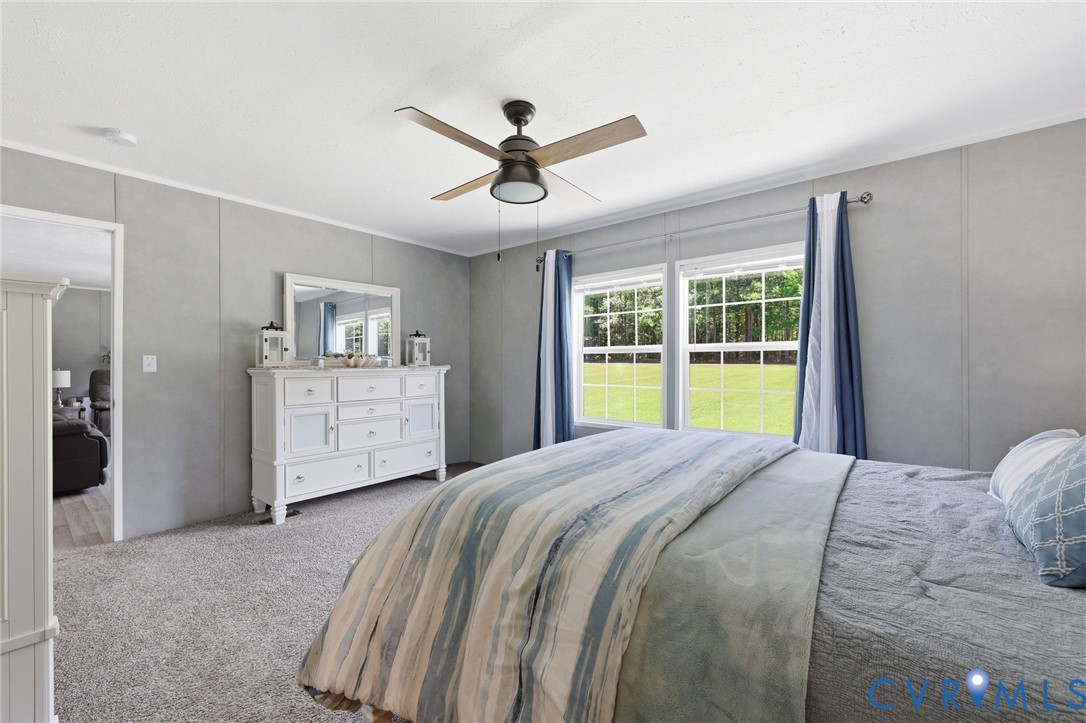 8952 White Oak Church Road Wilsons, VA 23894 - Photo 20 of 37 Carpeted Floor with Ceiling Fan