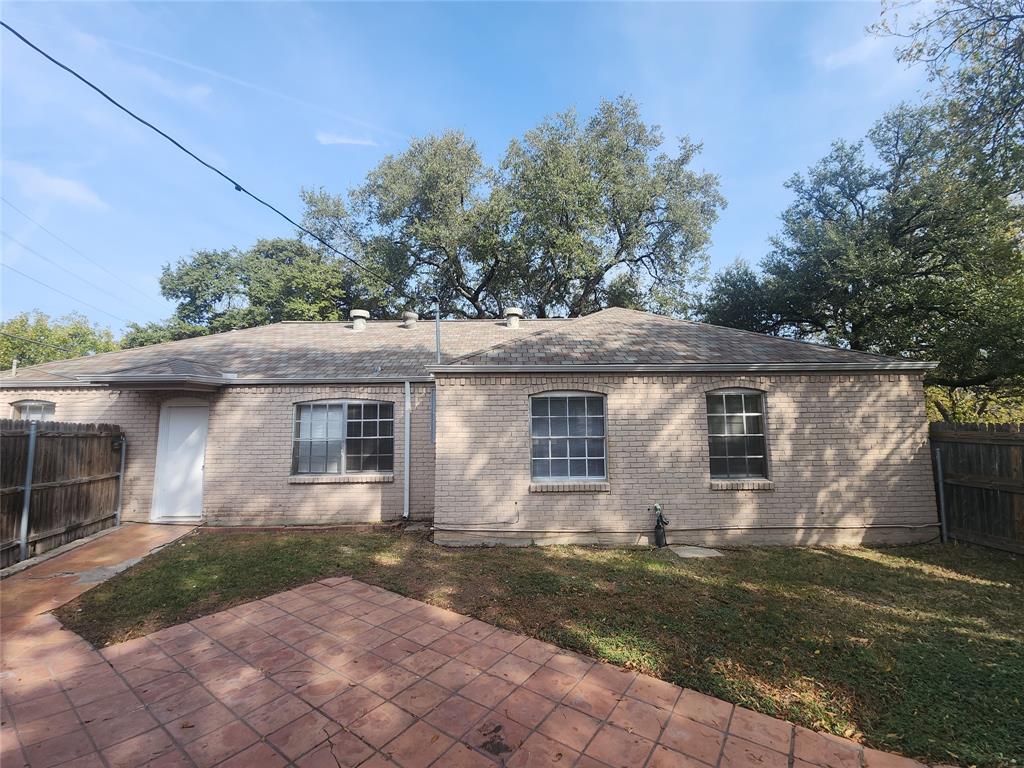 3454 Guadalupe Road Fort Worth, TX 76116 - Photo 20 of 21 Back of property with a shingled roof and brick siding