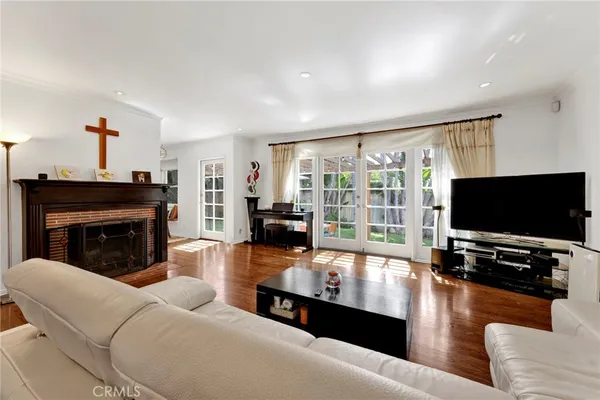 a living room with furniture flat screen tv and a fireplace