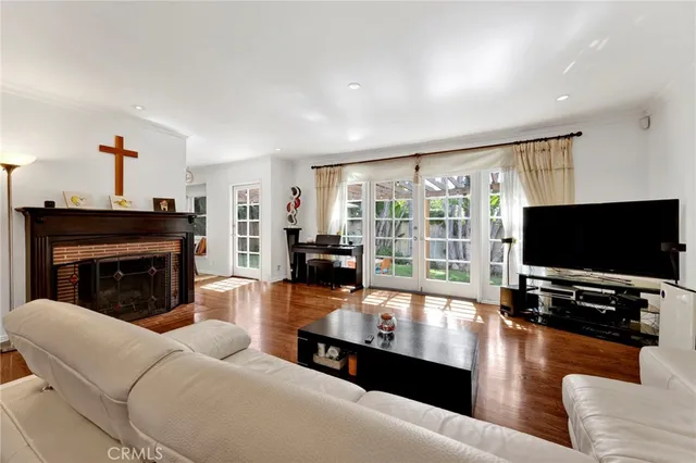 a living room with furniture flat screen tv and a fireplace