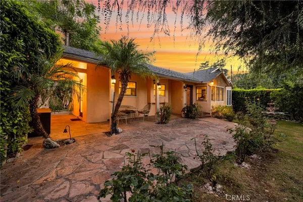 a view of outdoor space with deck and tree