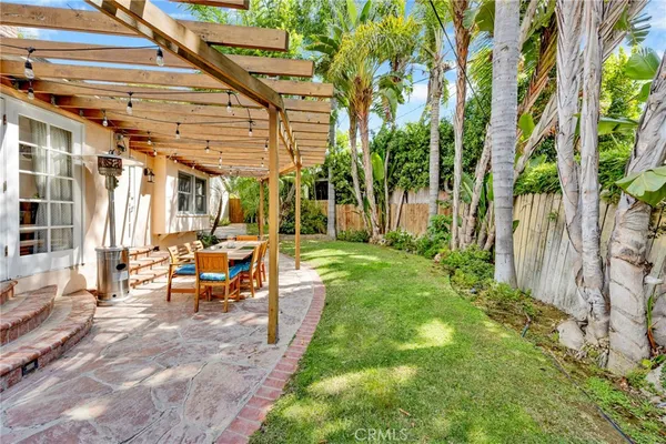 a view of yard with patio