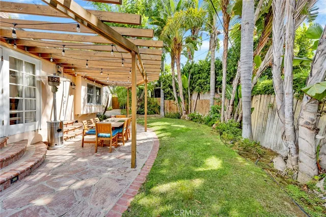 a view of yard with patio