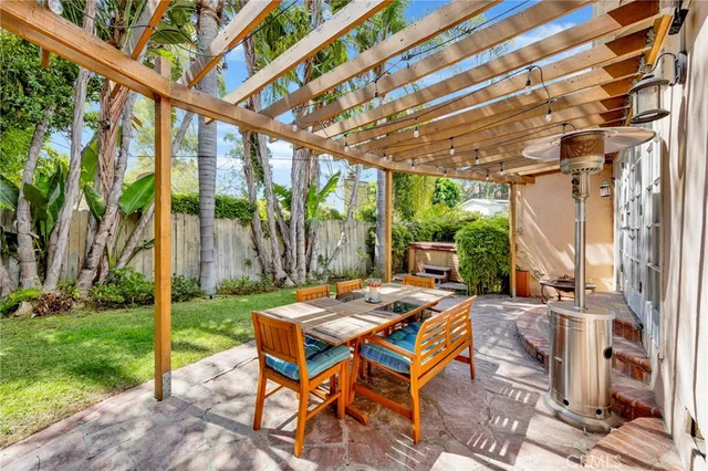 a view of an outdoor sitting area with furniture and garden view