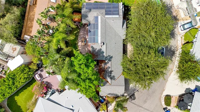 an aerial view of a house with a yard and garden