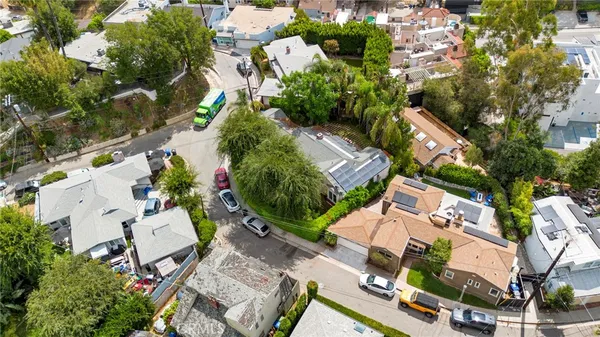 an aerial view of residential house with outdoor space and street view