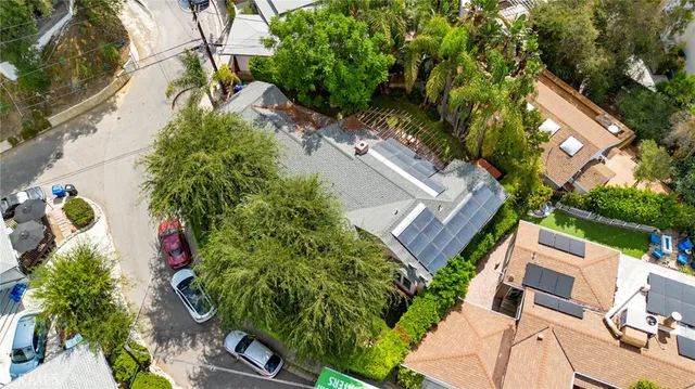 an aerial view of a house with a yard and garden