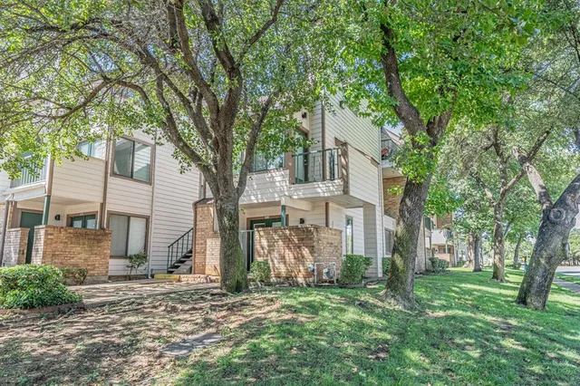 front view of a house with a big yard