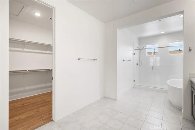 a bathroom with a shower and a toilet