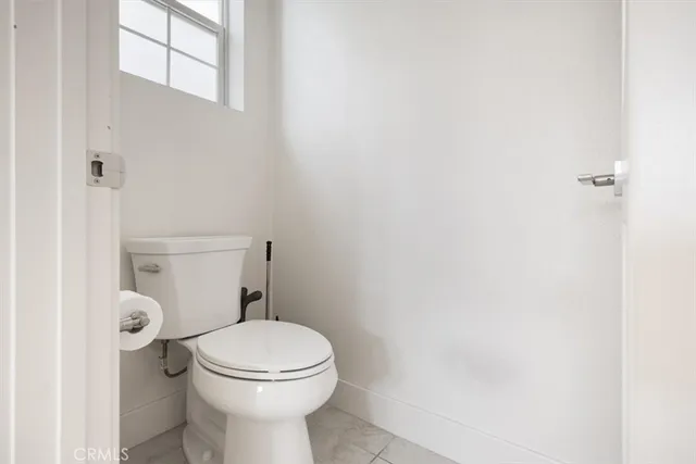 a bathroom with a toilet and a sink