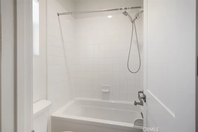 a bathroom with a shower and a shower