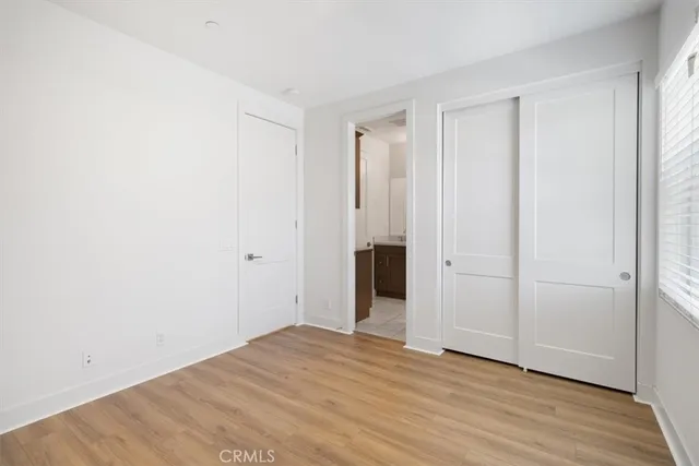 a view of a livingroom with wooden floor