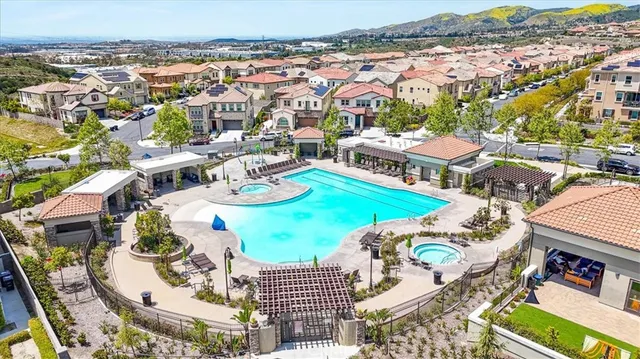 an aerial view of residential houses with outdoor space