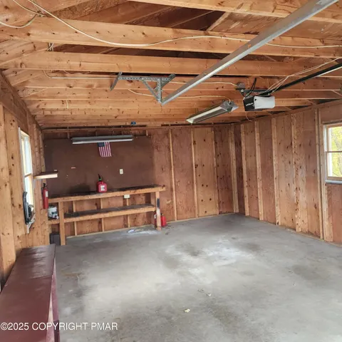 a large kitchen with a refrigerator and a stove