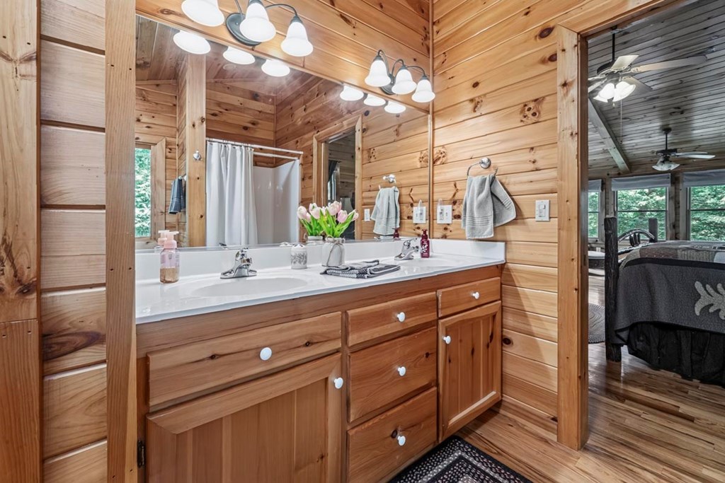115 Lakota Trail Blue Ridge, GA 30513 - Photo 26 of 49 a bathroom with a double vanity sink and mirror