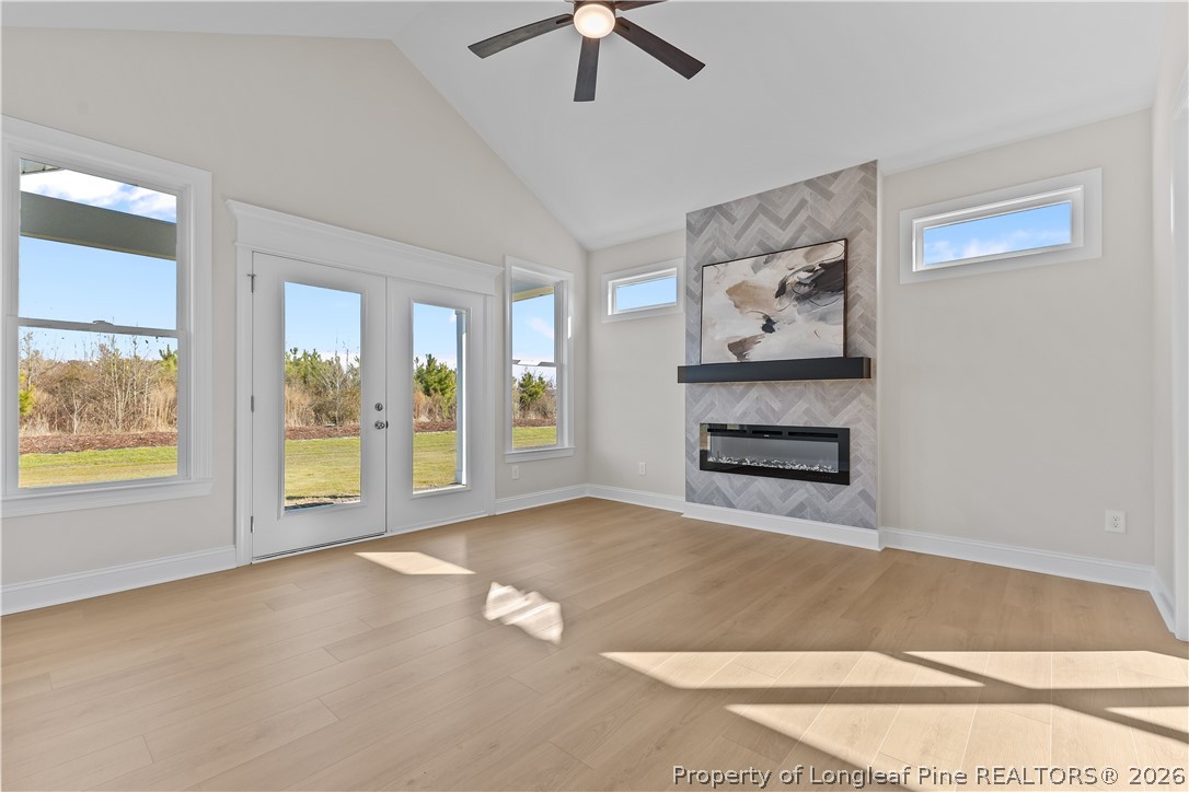 108 Sunny Acres Lane Clinton, NC 28328 - Photo 12 of 30 a view of an empty room with a window and a kitchen