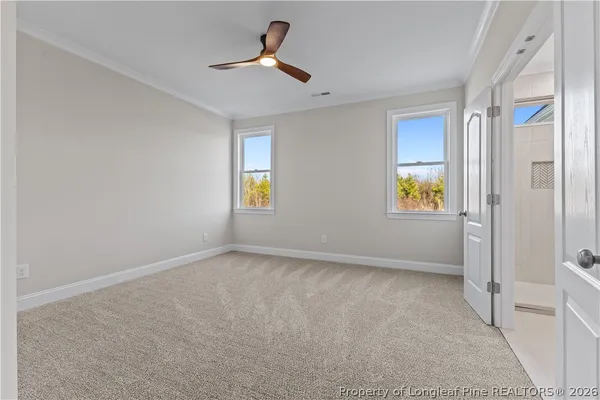 a view of an empty room and a window