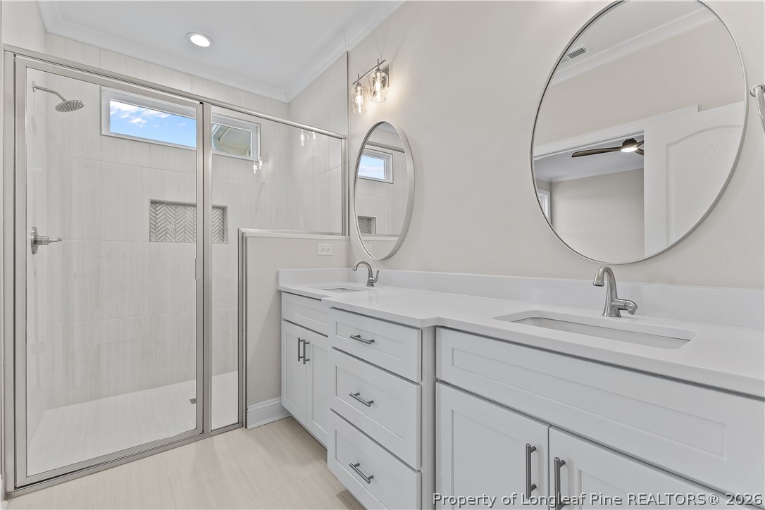 108 Sunny Acres Lane Clinton, NC 28328 - Photo 18 of 30 a bathroom with double vanity sink and a mirror