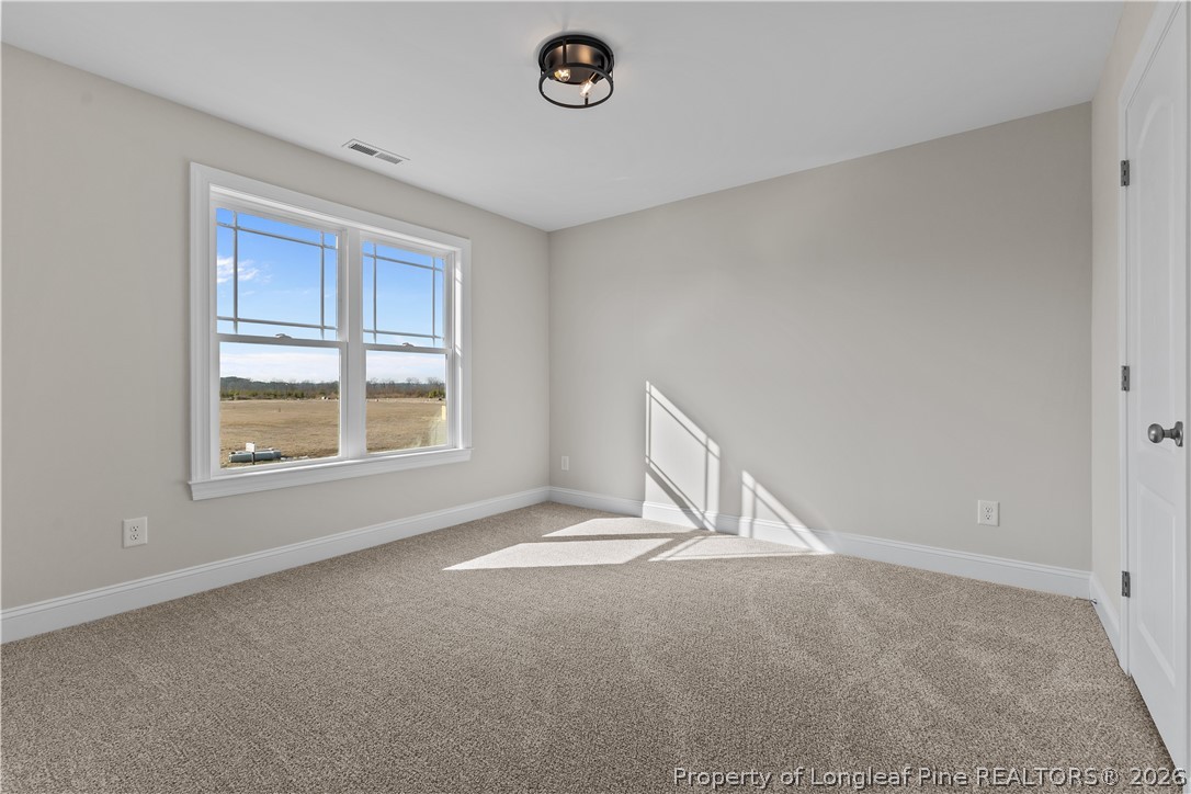 108 Sunny Acres Lane Clinton, NC 28328 - Photo 22 of 30 a view of an empty room with a window