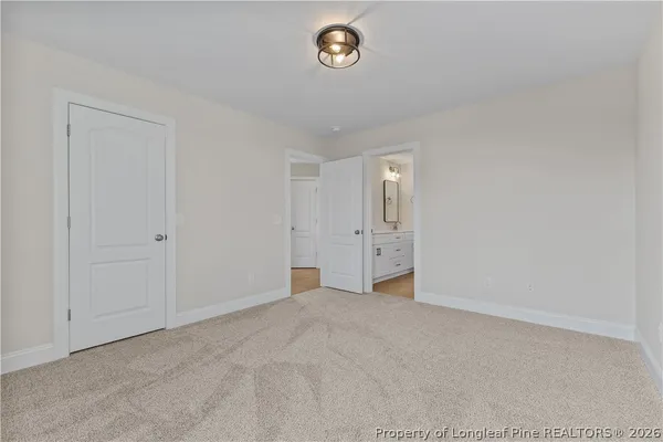 a view of an empty room and a window