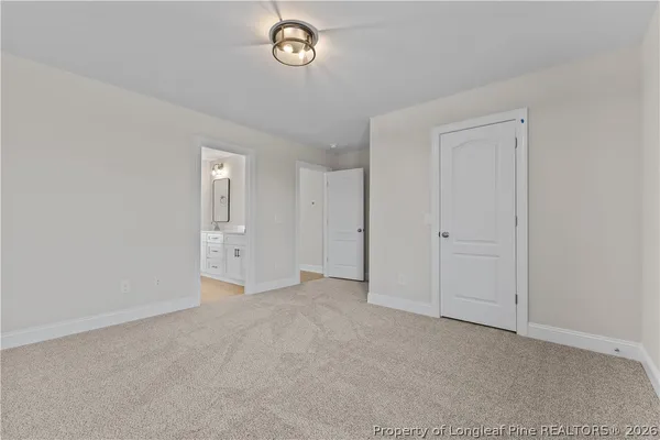 an empty room with windows and entrance