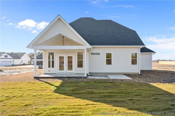a front view of a house with a swimming pool