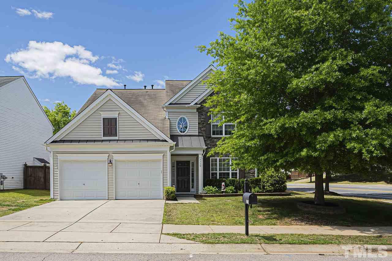 7759 San Gabriel Street Raleigh, NC 27613 - Photo 1 of 30 a front view of a house with garden