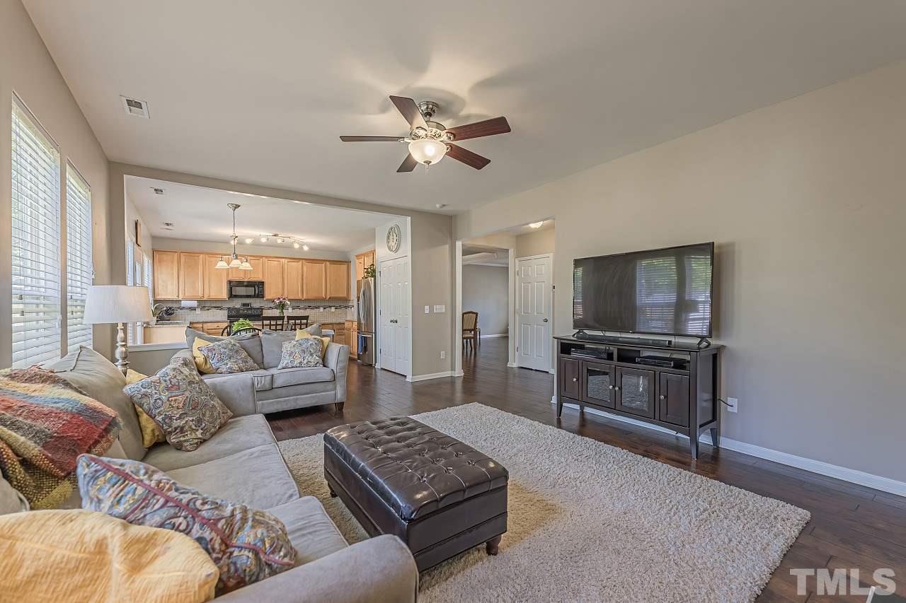 7759 San Gabriel Street Raleigh, NC 27613 - Photo 11 of 30 a living room with furniture and a flat screen tv