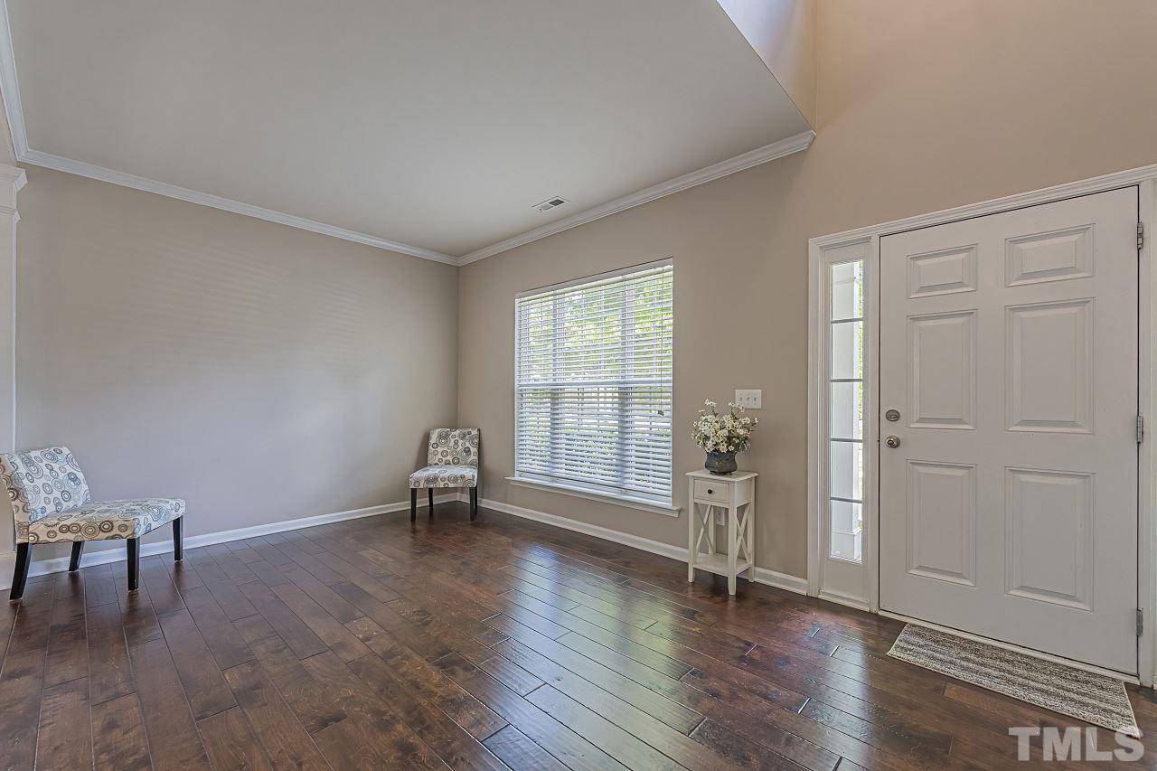 7759 San Gabriel Street Raleigh, NC 27613 - Photo 4 of 30 an empty room with wooden floor and a window