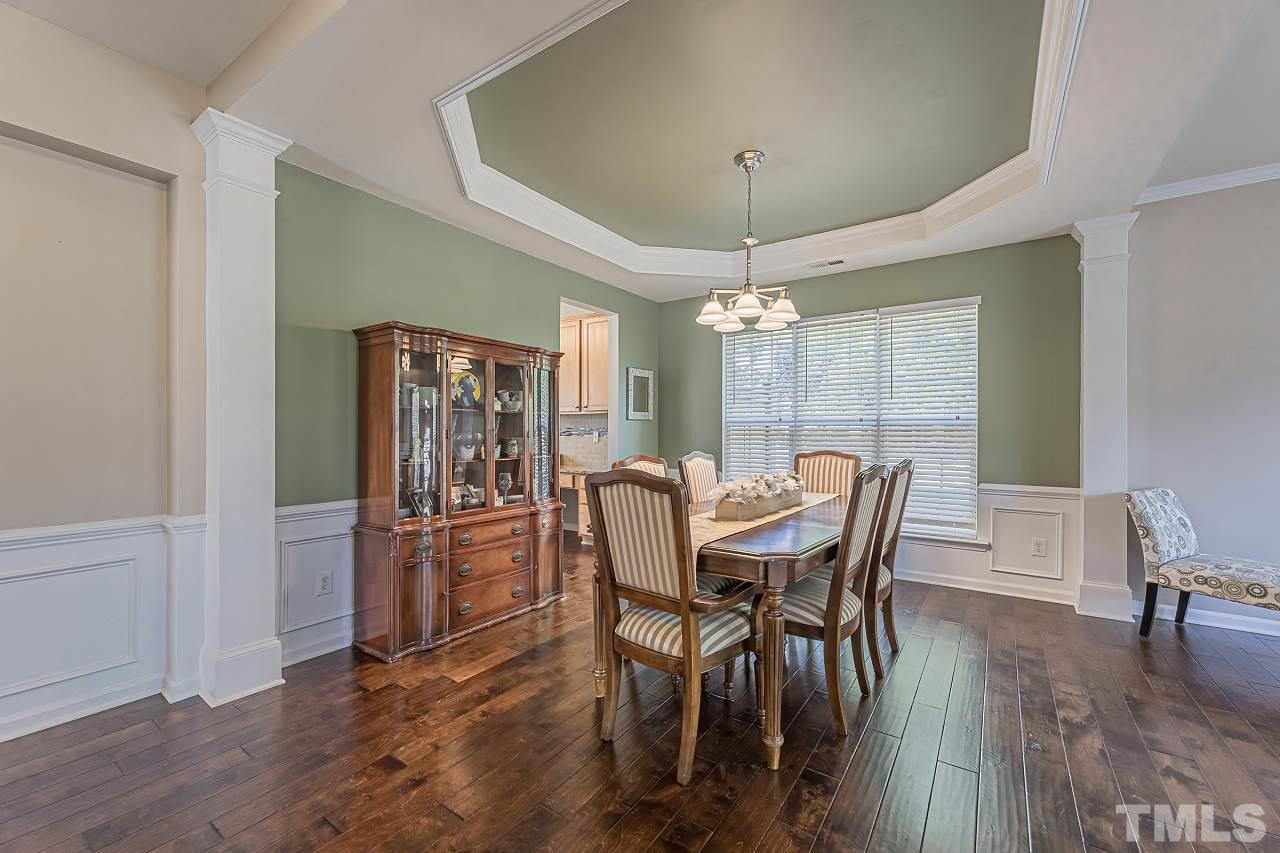 7759 San Gabriel Street Raleigh, NC 27613 - Photo 5 of 30 a view of a dining room with furniture window and wooden floor
