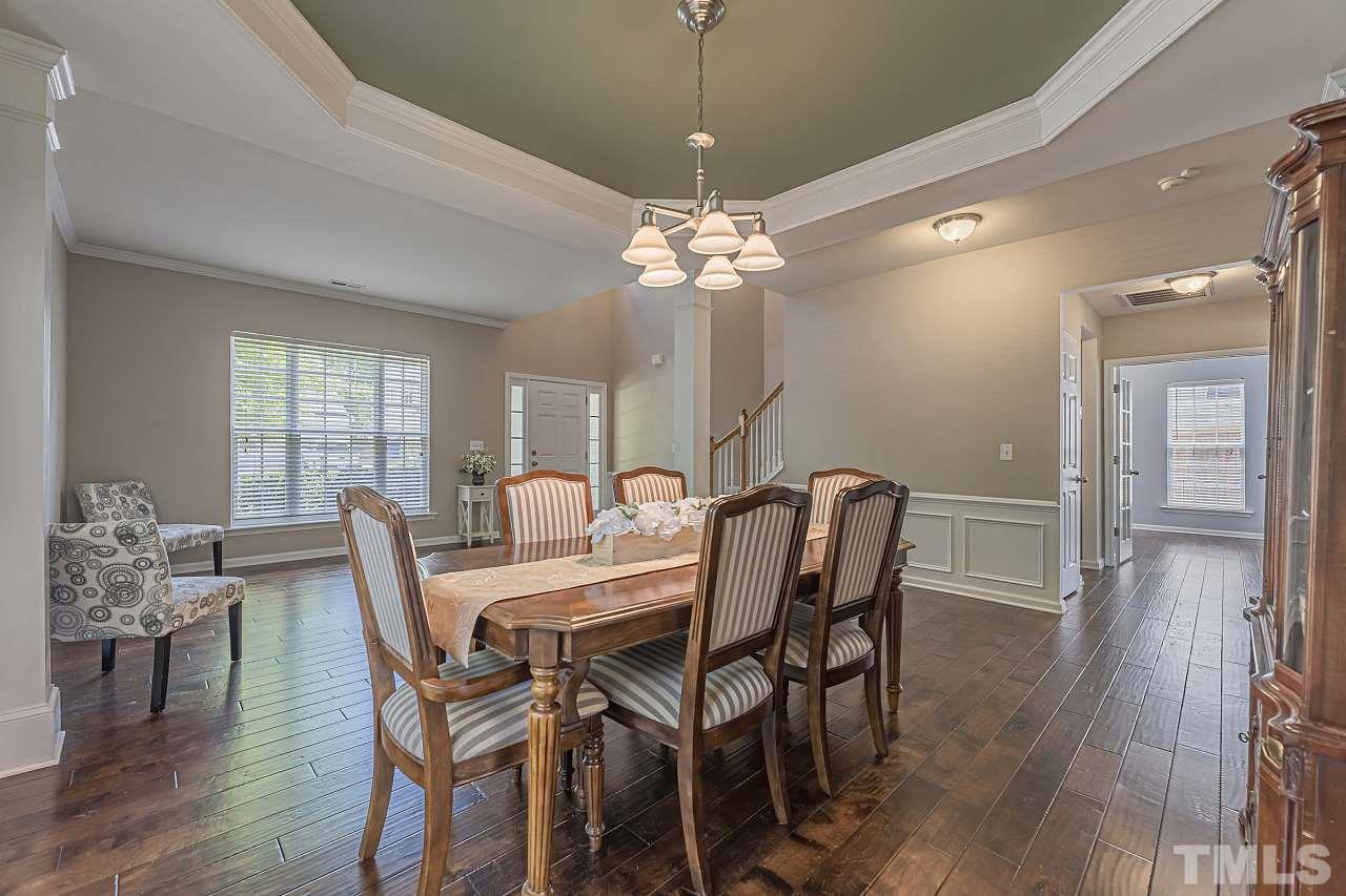 7759 San Gabriel Street Raleigh, NC 27613 - Photo 6 of 30 a view of a dining room with furniture window and wooden floor