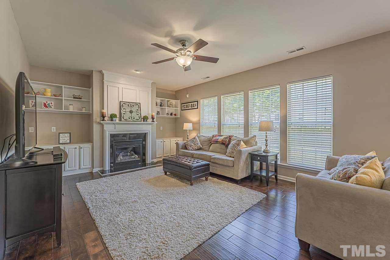 7759 San Gabriel Street Raleigh, NC 27613 - Photo 9 of 30 a living room with furniture and a fireplace