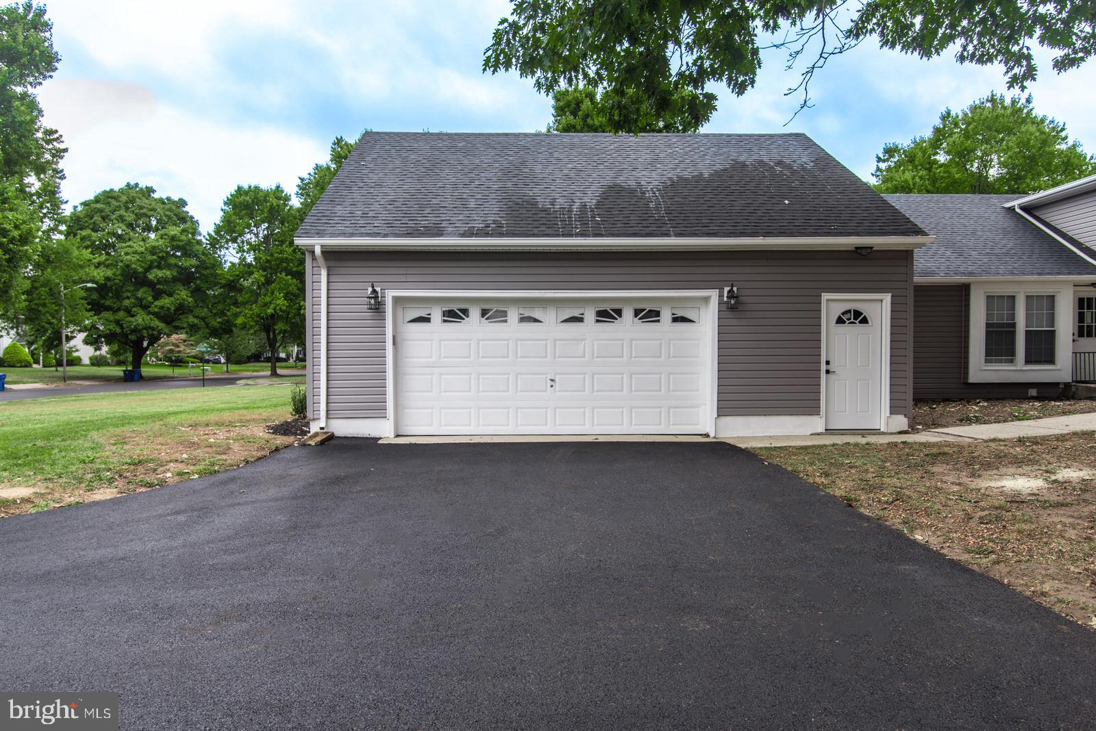 558 Sentinel Road Moorestown, NJ 08057 - Photo 142 of 144 a front view of a house with a yard and garage