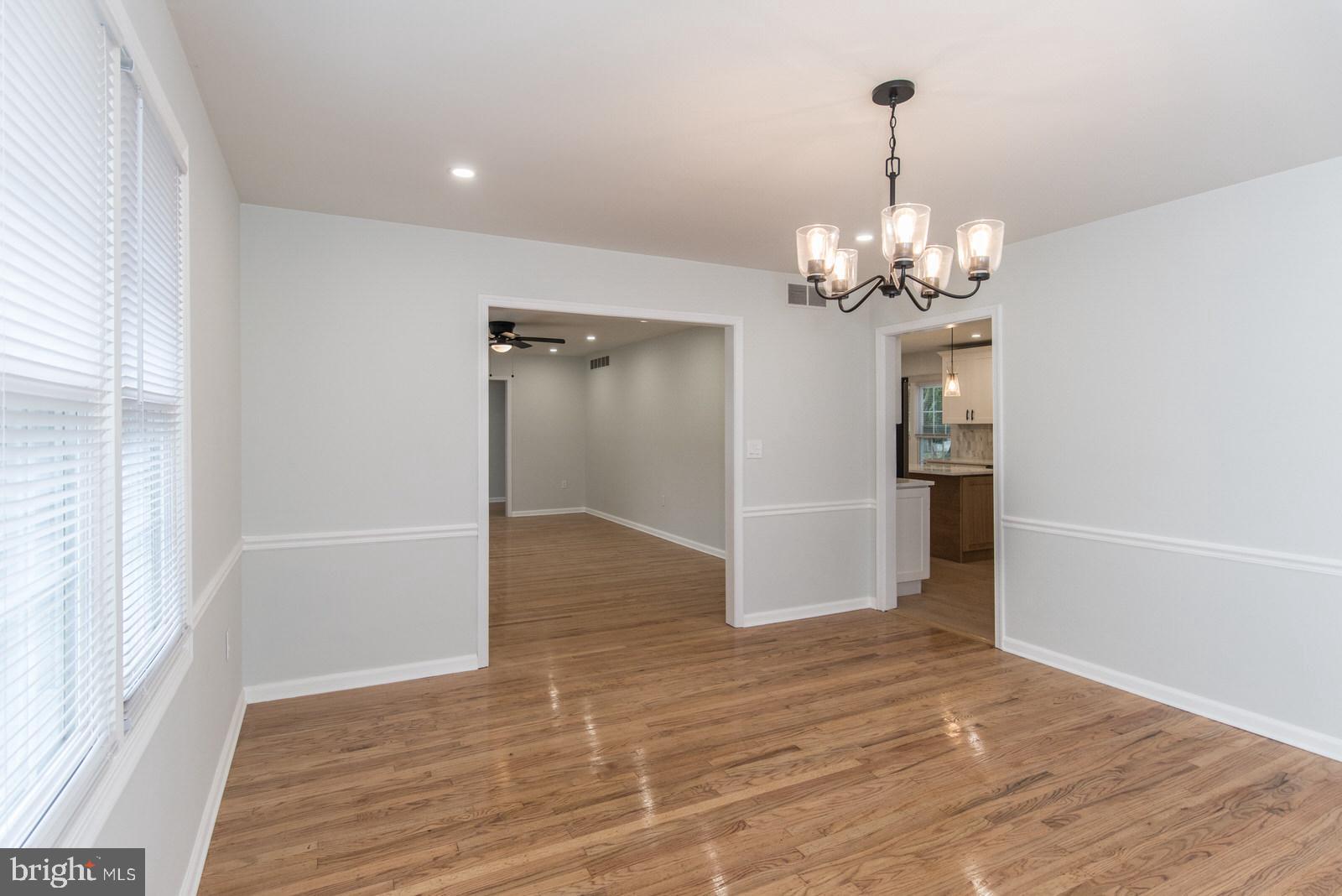 558 Sentinel Road Moorestown, NJ 08057 - Photo 31 of 144 a view of livingroom with chandelier and wooden floor